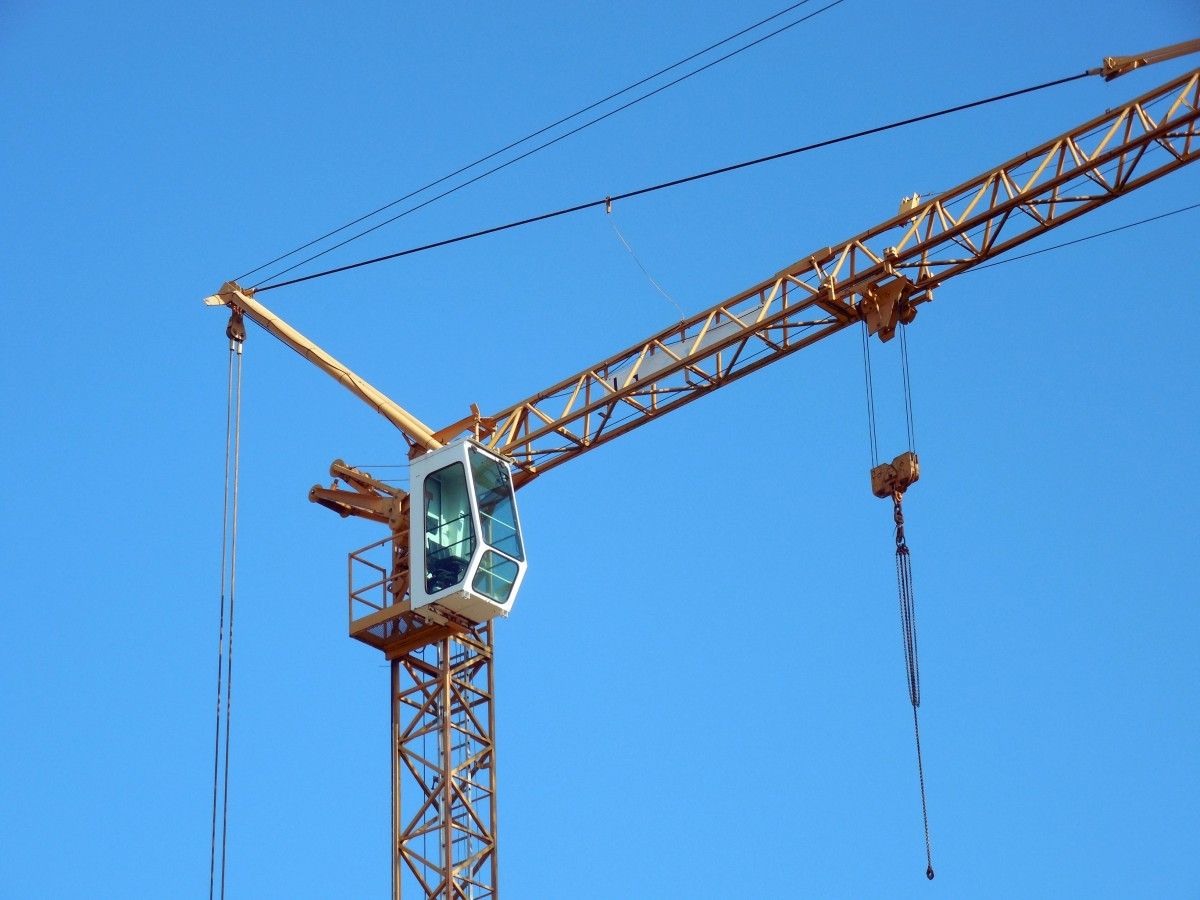 Tower crane against a blue sky